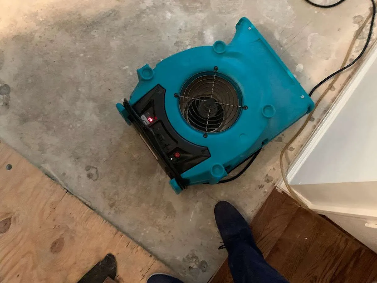 Air mover drying subfloor during Leak Detection & Repair in Kaneohe Base